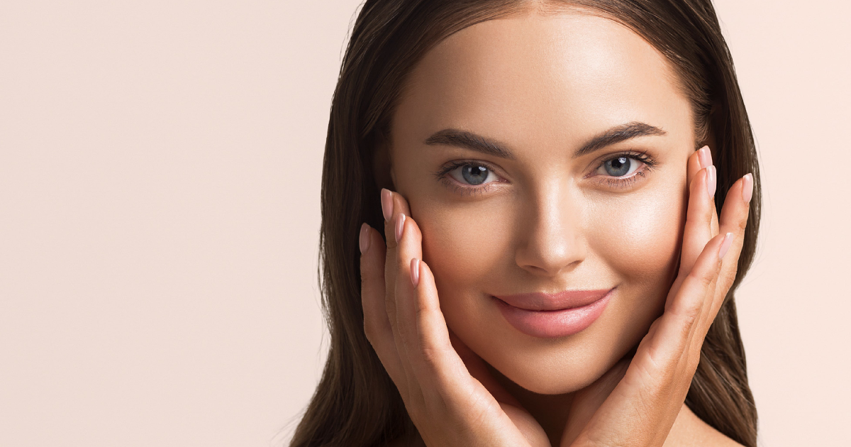 A woman showing her glowing, smooth skin after CBD Signature treatment in Flower Mound, TX,