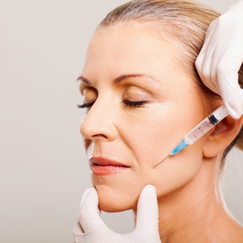 A Woman getting injection on cheek | Get the best Injectable in Flower Mound, Texas | Spa Vela